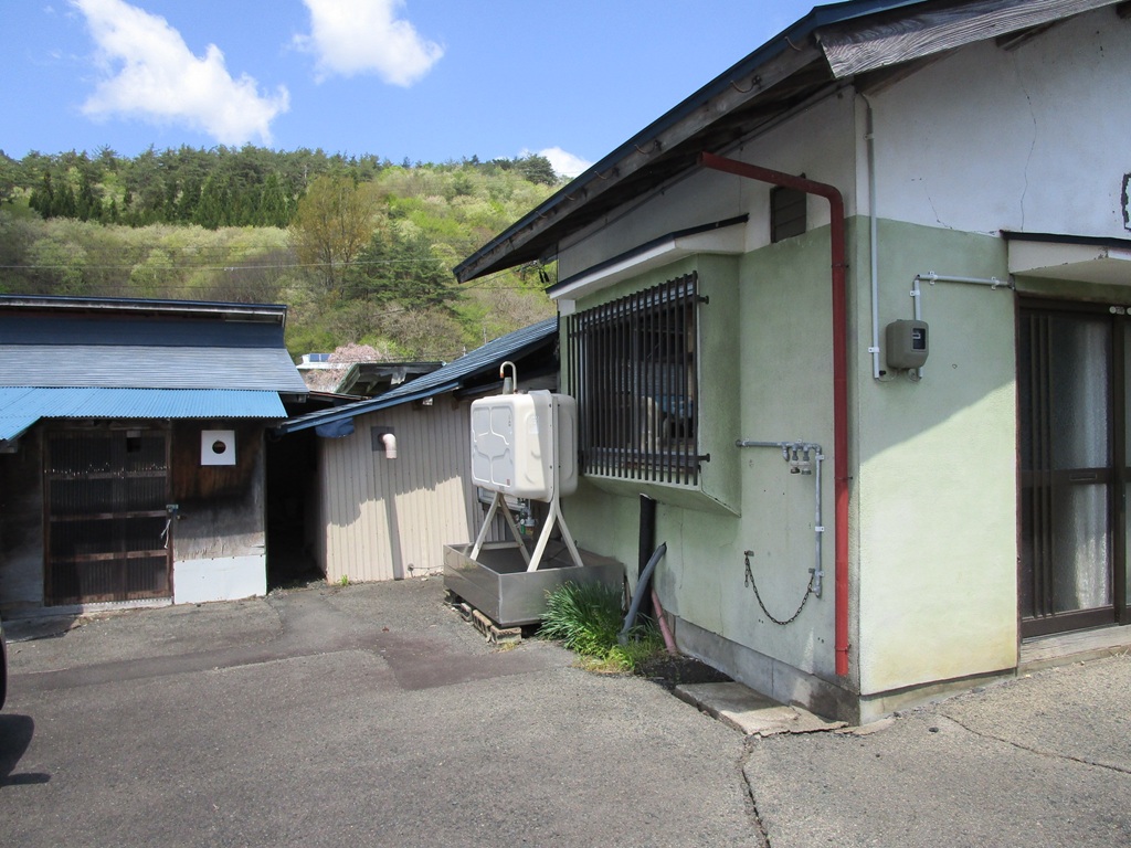 1960s wood house with outbuildings in Iwate