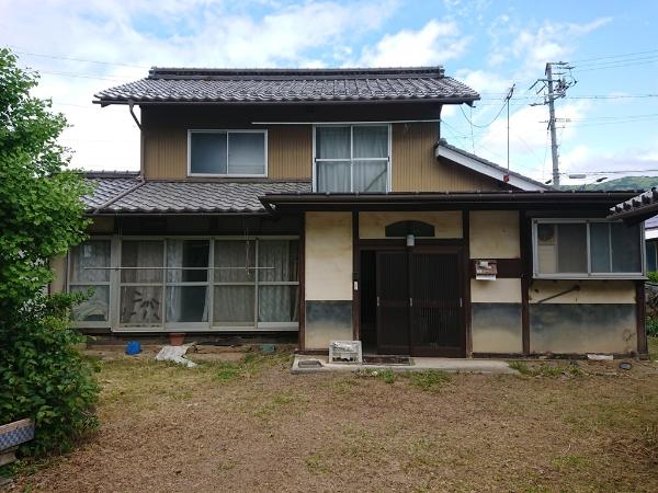Wooden 2-story house with garden and field