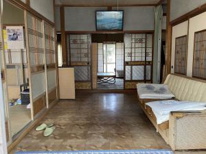 1970s wood house with outbuildings in Niigata