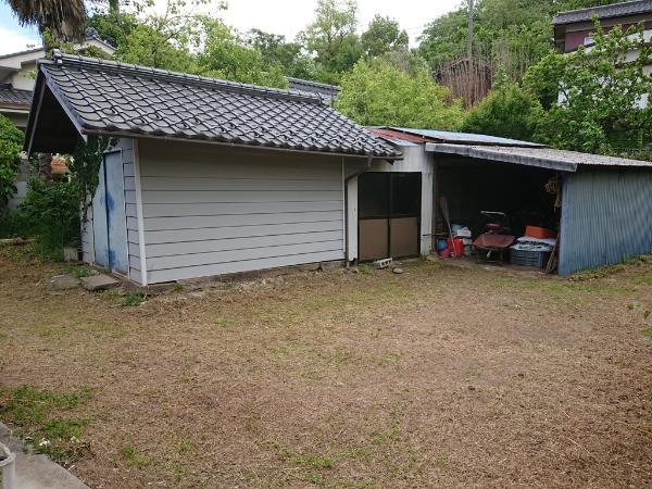 Wooden 2-story house with garden and field