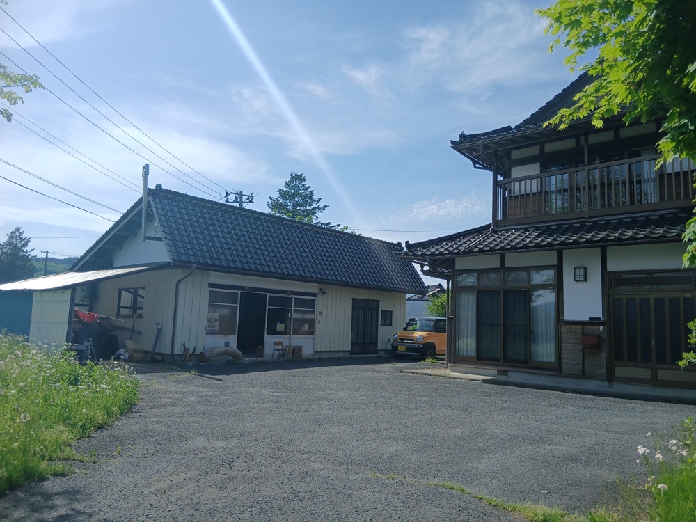 1970s wood house with outbuildings in Iwate
