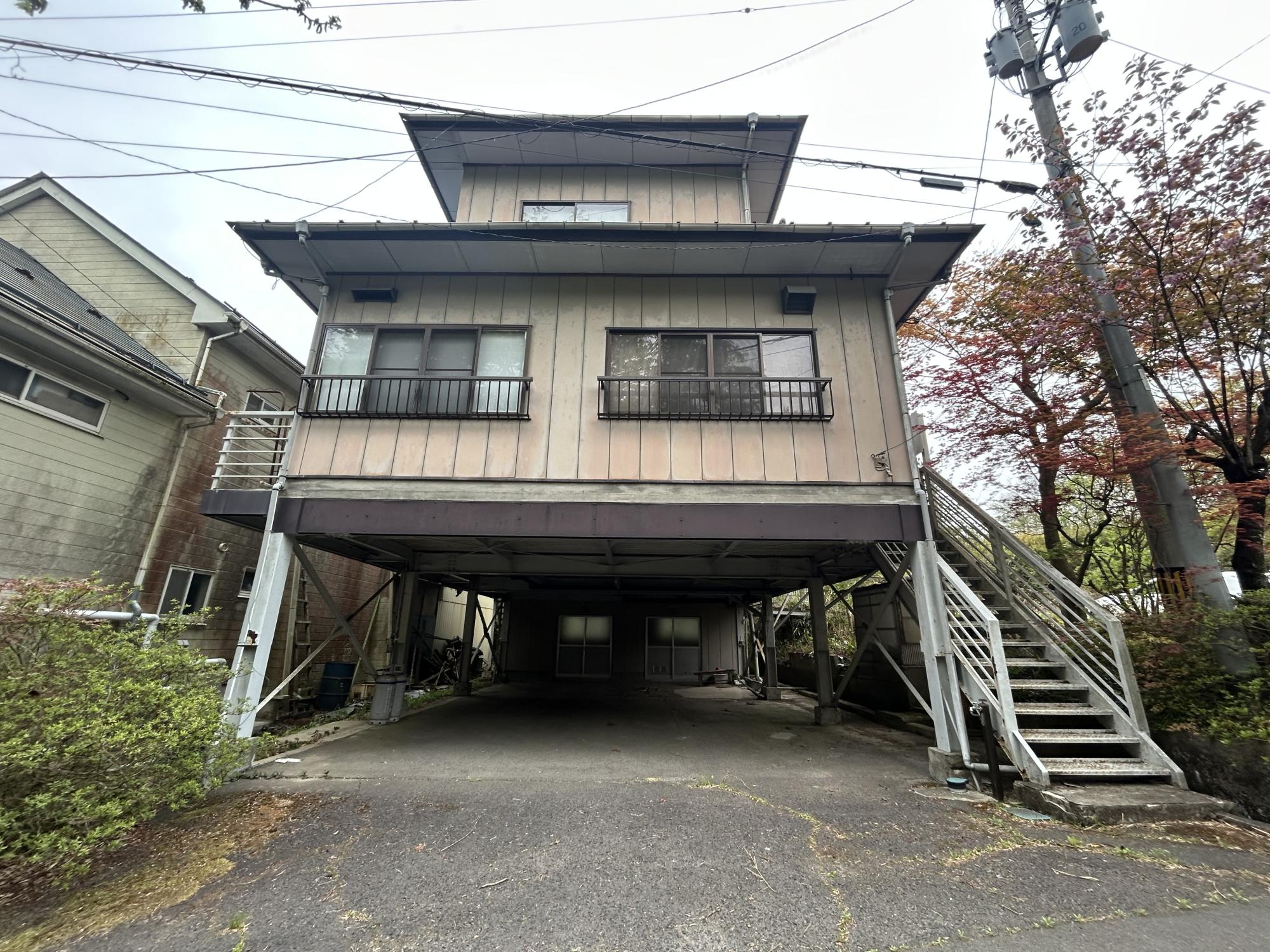 3-story house with garage and storage on first floor, suitable for rental conversion
